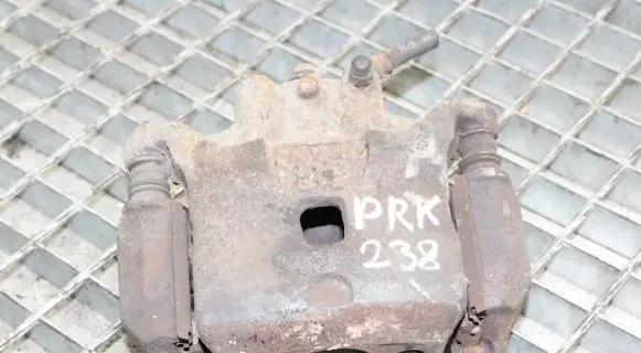 Nissan Juke I F15 Front brake caliper