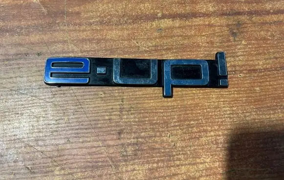 Volkswagen e-Up Manufacturers badge/model letters 12E853687