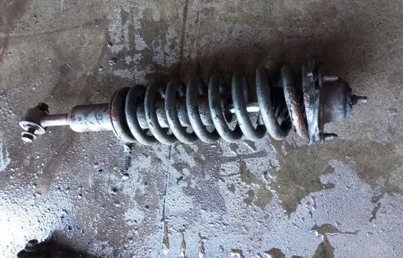 Toyota Land Cruiser (J120) Front shock absorber with coil spring