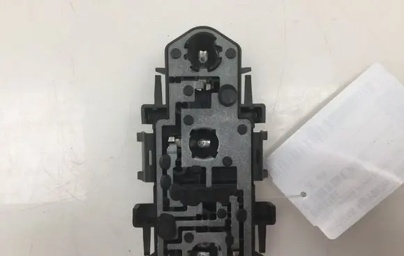 Tail light bulb cover holder