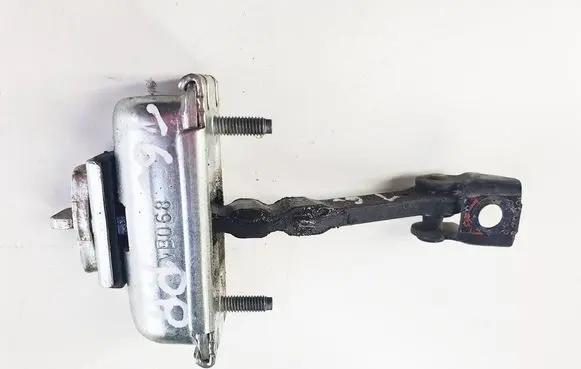 Front door check strap stopper