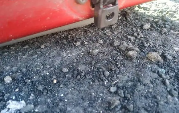 Front door check strap stopper
