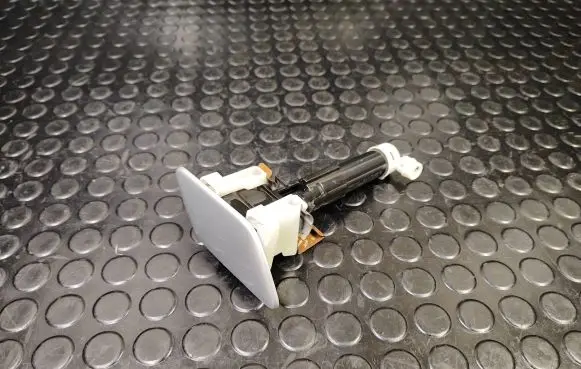 Headlight washer spray nozzle