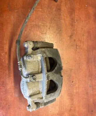 Ram 1500 Front brake caliper A002U688