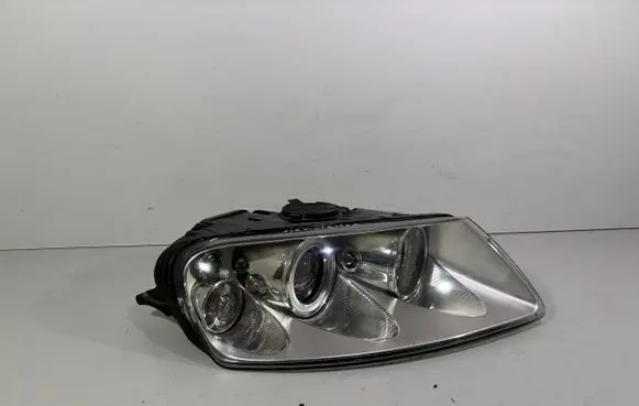 Volkswagen Touareg I Headlight/headlamp 12784343643