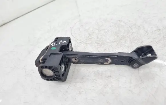 Front door check strap stopper