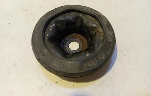 Volkswagen Caddy Front coil spring rubber mount 357412319B