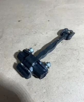 Front door check strap stopper