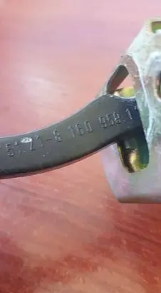Front door check strap stopper