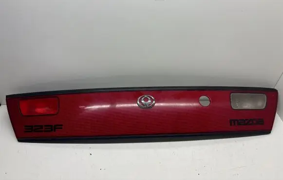 Mazda 323 F Trunk door license plate light bar 0431441