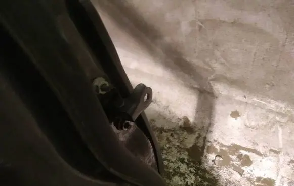Front door check strap stopper