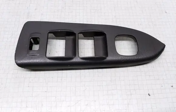 Mazda 626 Front door window switch trim 