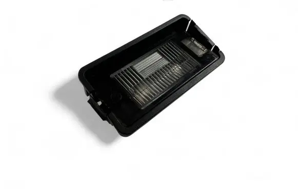 Trunk door license plate light bar
