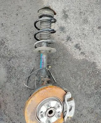 KIA Sportage Front shock absorber with coil spring 546603U000