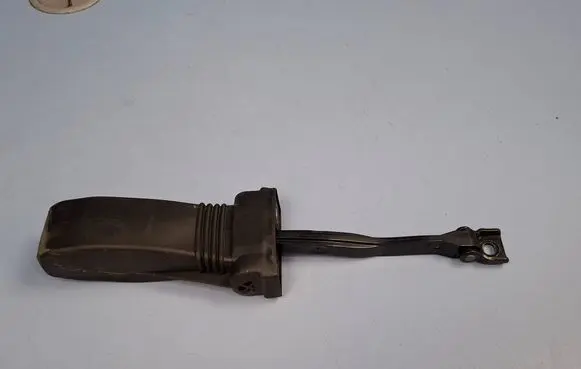 Front door check strap stopper