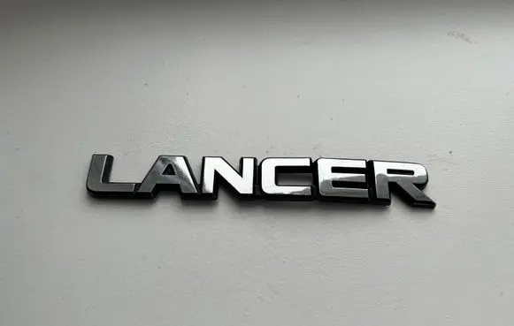 Mitsubishi Lancer Manufacturers badge/model letters 