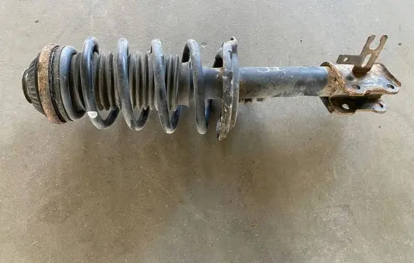 Nissan Qashqai Front shock absorber with coil spring 24466551 22231390 644609745