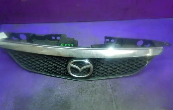 Mazda 323 Front bumper upper radiator grill