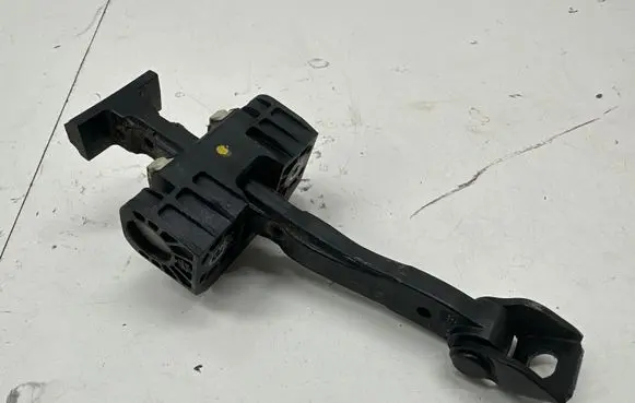Front door check strap stopper