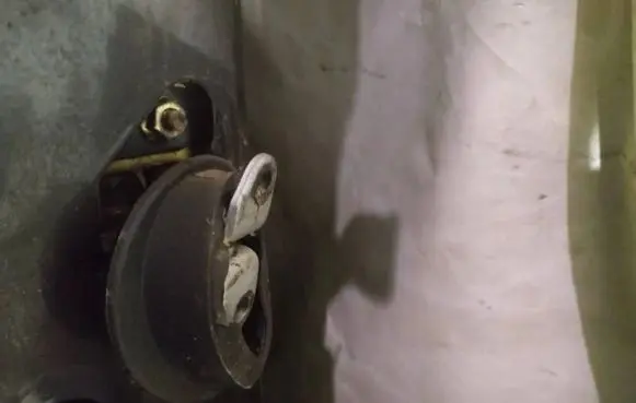 Front door check strap stopper