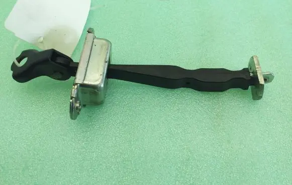 Nissan Pulsar Front door check strap stopper