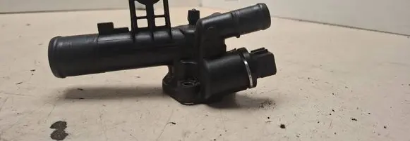 Thermostat/thermostat housing