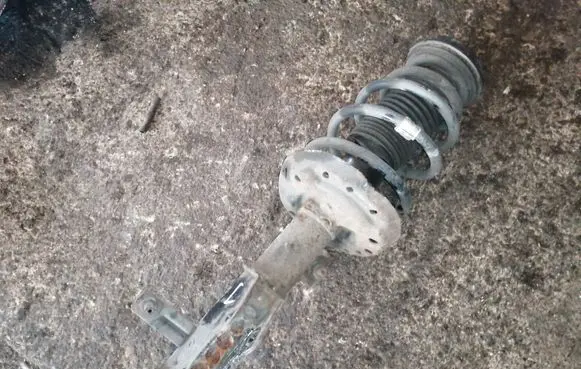 Front shock absorber with coil spring