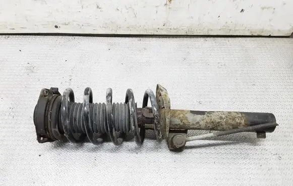 Volkswagen Caddy Front shock absorber with coil spring