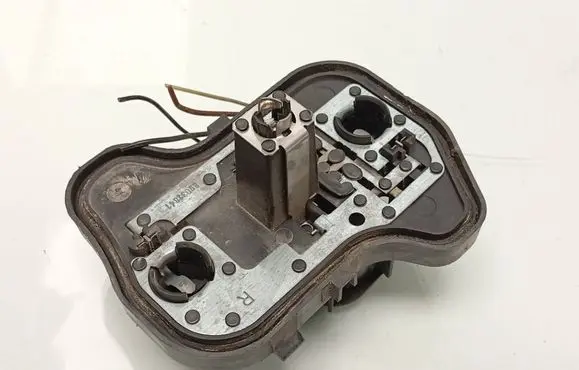 Tail light bulb cover holder