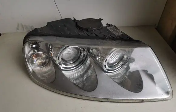 Volkswagen Touareg I Headlight/headlamp 7L6941016BK 7L6941016 89307861