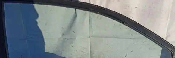 Mazda 323 Front door window glass four-door Melyna
