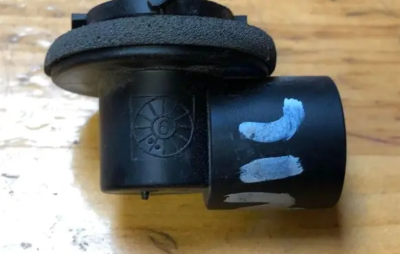 Tail light bulb cover holder