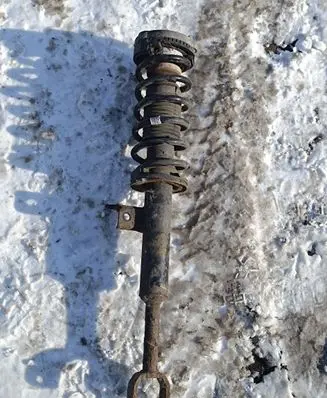 Front shock absorber with coil spring