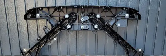 Engine bonnet/hood lock trim molding