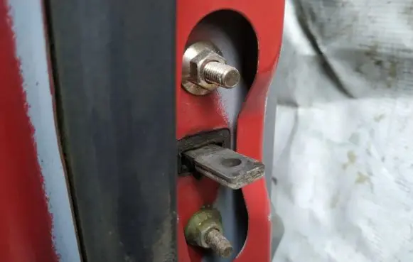Mazda 121 Front door check strap stopper 