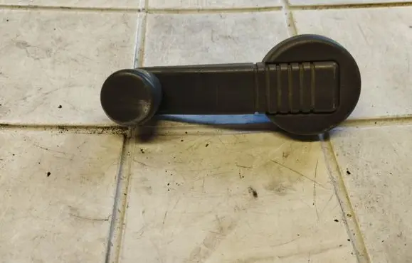Renault Kangoo I Front door window winding handle 7700794752