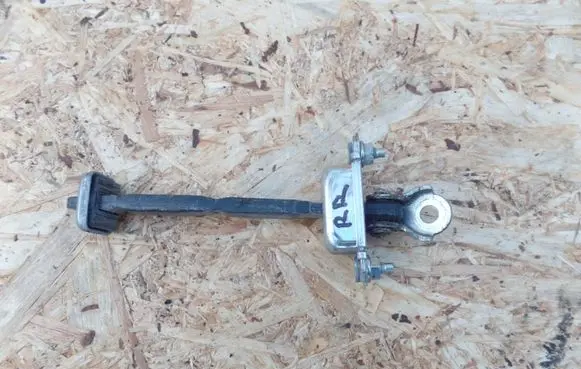 Subaru Legacy Rear door check strap stopper