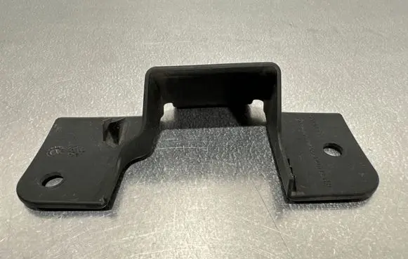Engine bonnet/hood lock trim molding