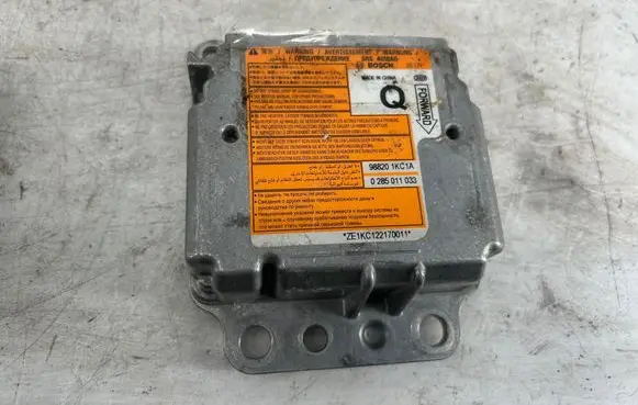 Nissan Juke I F15 Airbag control unit/module 988201KC1A 0285011033