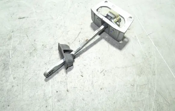 Front door check strap stopper