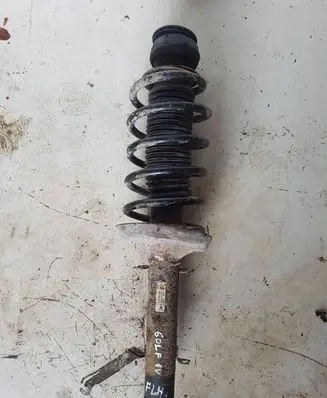 Volkswagen Golf IV Front shock absorber with coil spring 1J0413031AE