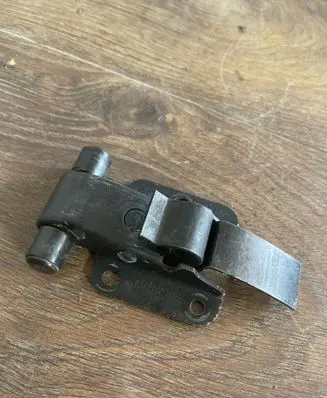 Front door check strap stopper