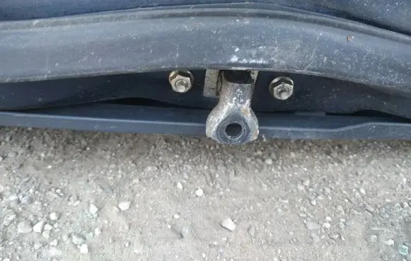 Front door check strap stopper
