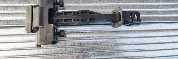 Front door check strap stopper
