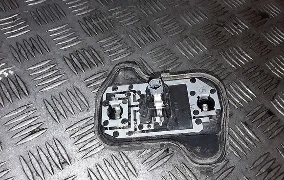 Tail light bulb cover holder