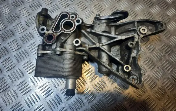 Volkswagen PASSAT CC Oil filter mounting bracket 06J903143AG