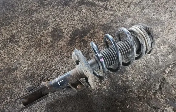 Front shock absorber with coil spring