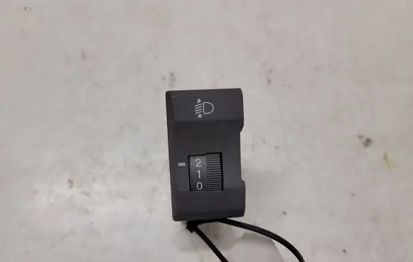 KIA Carens I Headlight level height control switch