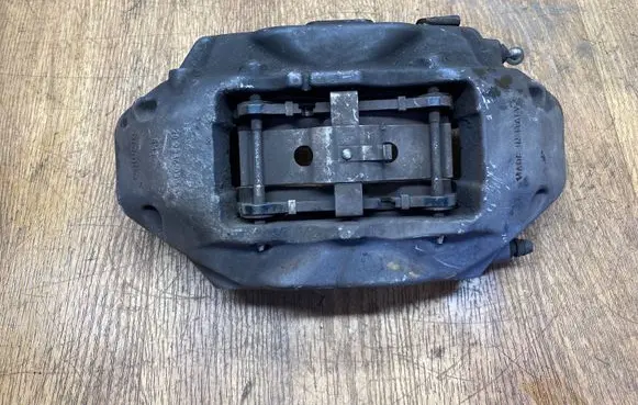 Volkswagen Touareg II Front brake caliper 7P6615105AJ