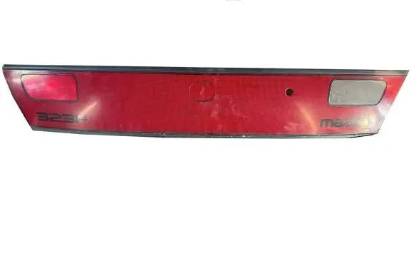 Mazda 323 F Trunk door license plate light bar 0431441